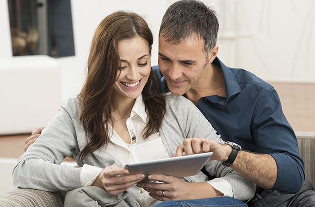 Couple viewing tablet Couple viewing tablet