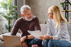 a couple reviewing paperwork for their income tax filing