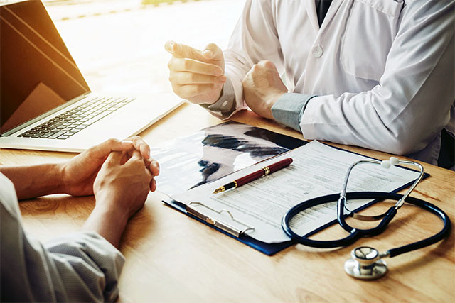 doctor consults with a patient