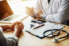 doctor consults with a patient