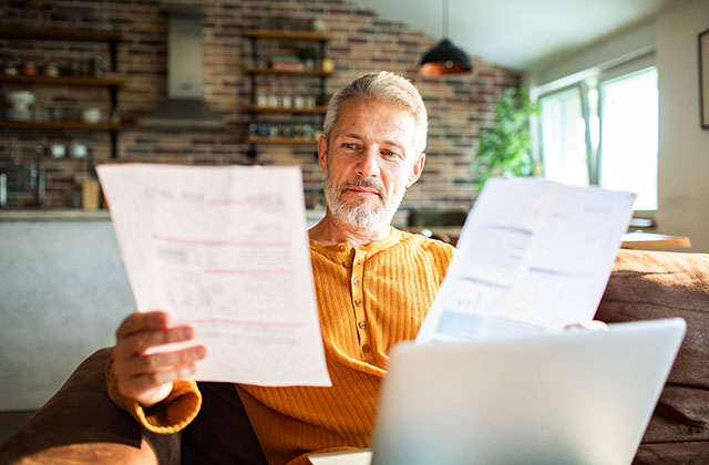 mature male reviewing paperwork