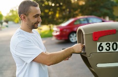 a man checking his mailbox