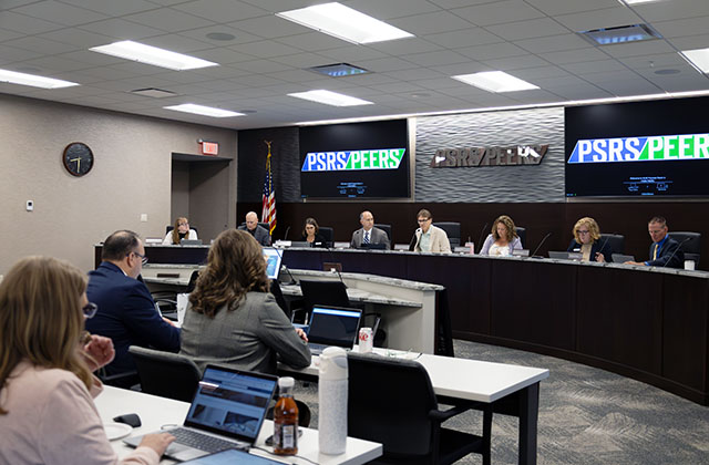 A photo of the PSRS/PEERS board room with trustees seated at the dais.