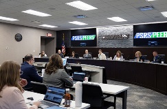 A photo of the PSRS/PEERS board room with trustees seated at the dais.