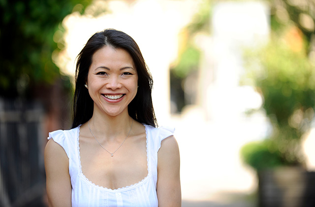 young woman in an outdoor setting smiling at the camera 