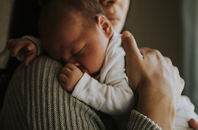 mother holding an infant