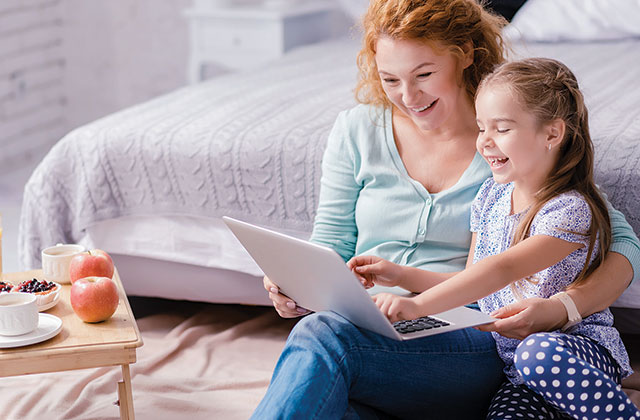 mother and daughter with laptop