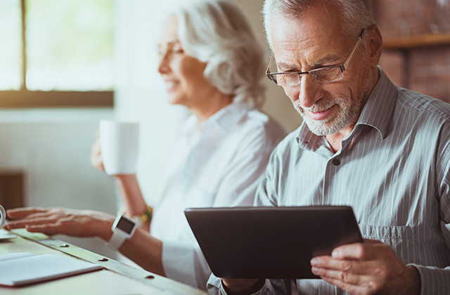 older couple with tablet