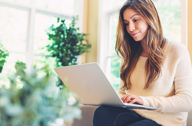 woman typing on laptop computer